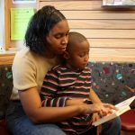 mother reads to son