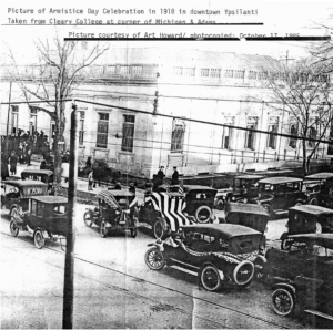 image of Model T's in front of 229 W Michigan Avenue at the Armistice Day parade of 1918