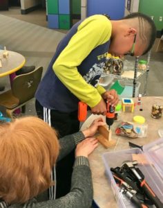 boy using power drill
