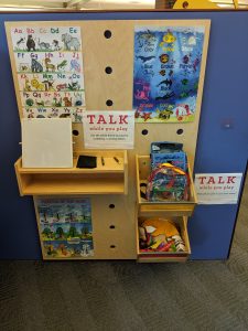 School posters and toys along a wall