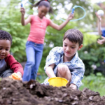Kids dig in dirt, play with a jump-rope, and toss a ball.