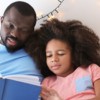 father reads to his daughter