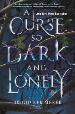 A Curse So Dark and Lonely. Branches intertwine with each other and the words on the cover.