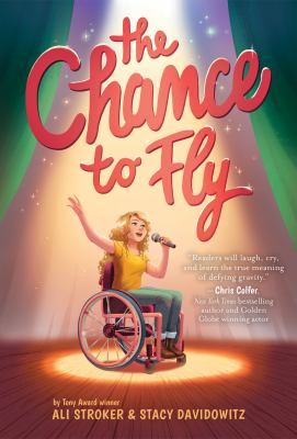 The Chance to Fly by Ali Stroker and Stacy Davidowitz. A girl in a wheelchair sings on a stage.
