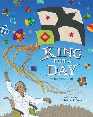 King for a Day. A boy in a wheelchair flies a kite, with other kites in the background.