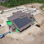 An aerial view of teh new superior building. The solar panels being installed.