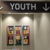 Mural artwork on the wall underneath a sign that says Youth.